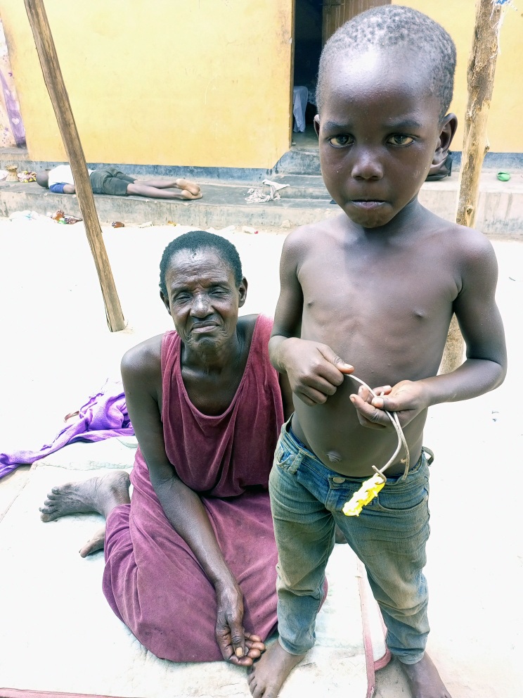 Innocent with the elderly woman who rescued him